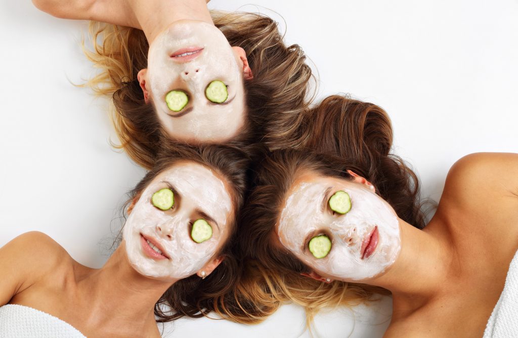 Three friends with facial masks